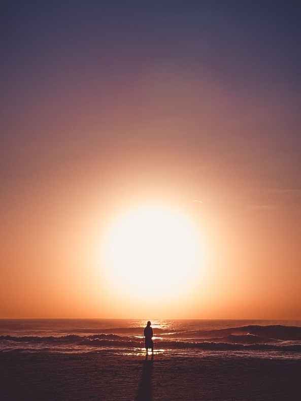 person standing on shore